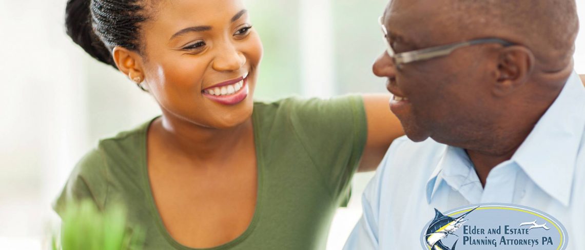elder care attorney - Young African-American woman with elder African American man