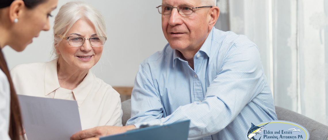 estate planning lawyer - elder couple meeting with a professional - estate planning lawyer